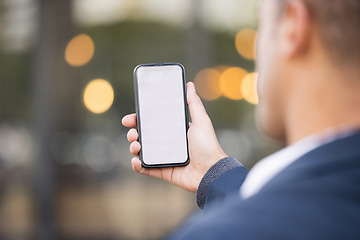 Image showing Businessman, hand and mockup phone in city for schedule planning app, email communication or networking. Man, smartphone mockup space and reading screen for calendar, web article and financial news