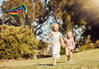 Image showing Kite, running and children running in an outdoor park with summer fun and smile. Nature, kids vacation and happiness of kids ind sunshine with freedom and smiling bonding together on green grass