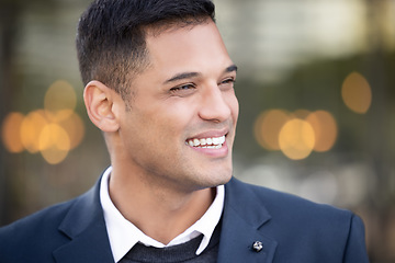 Image showing Business man, smile and city bokeh lights with a young professional feeling happy about work. Outdoor, worker and happiness of a businessman ready for working with success and proud smiling outdoor