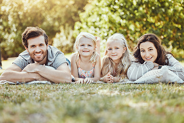 Image showing Family, park and portrait of parents and children outdoor on garden grass with love and smile. Happy, nature and kids with mom and dad together on vacation with parent care and fun relax on a picnic