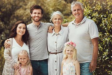 Image showing Nature, happy and portrait of a big family in a garden while on a summer vacation together. Parents, grandparents and children on holiday, adventure or weekend trip at an outdoor park with happiness.