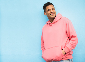 Image showing Happy, casual and man in studio thinking, relax and normal against a blue background space. Laugh, contemplation and chilling Mexican man standing against mockup, real and cheerful while isolated