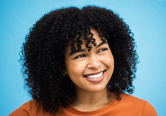 Image showing Happy, black woman or afro hairstyle on isolated blue background with keratin treatment, self love or healthcare wellness. Headshot, smile or beauty model with curly brunette trend on urban city wall