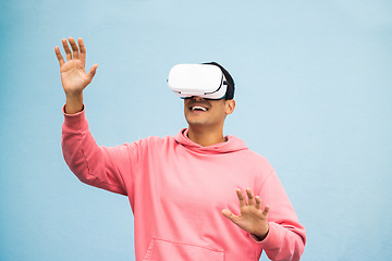 Image showing Vr, headset or metaverse fun on isolated blue background for ai esports, gaming cyber world or futuristic fantasy game. Smile, happy man or virtual reality with hands touching in digital software ar