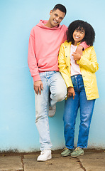 Image showing Couple of friends, bonding or hug portrait on isolated blue background in fashion, afro hair trend or cool style clothes. Smile, happy man or black woman in embrace on mock up backdrop in Brazil city