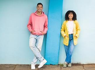 Image showing Couple of friends, bonding or portrait on isolated blue background in fashion, afro hair trend or cool style clothes. Smile, happy man or black woman on mock up backdrop, city wall or Brazil mockup