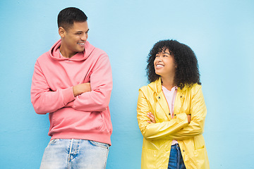 Image showing Couple of friends, happy and arms crossed on isolated blue background in city bonding, support and fun city travel. Smile, happy man or black woman and confidence, afro hair or fashion clothes mockup