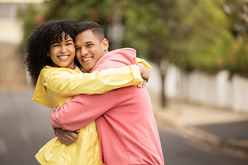 Image showing Happy black couple, hug and love portrait of people with care and bonding outdoor. Young woman, man and summer fun on a street walking with happiness embrace on vacation smiling together