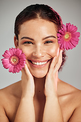 Image showing Flowers, skincare and face portrait of a woman with natural beauty and a smile for dermatology. Facial, wellness and self care for skin glow, nature cosmetics or makeup of a healthy model in studio