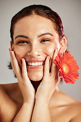 Image showing Happy portrait, beauty face and flower for skincare woman with dermatology and cosmetic. Floral facial, wellness and self care for freckles skin glow, healthy teeth and natural makeup model in studio