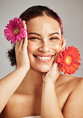 Image showing Skincare, daisy flower and beauty portrait of a woman for dermatology, makeup and cosmetics. Facial, wellness and self care for skin glow, floral product and happy face of a natural model in studio