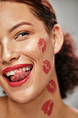 Image showing Beauty woman, lipstick kiss and face of makeup model in studio for cosmetics, love and happiness. Headshot of aesthetic person lick teeth for valentines day spa facial idea or skincare motivation