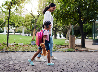 Image showing Mother, daughter and walking in a park, relax and bonding while holding hands and talking. Family, black woman and girl with sweet bond of love, enjoying and nature, parenthood and peaceful and day