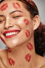 Image showing Face, red lipstick kiss and makeup on face model woman in studio for cosmetics and happiness. Headshot of aesthetic person happy about love for valentines day spa facial or skincare motivation