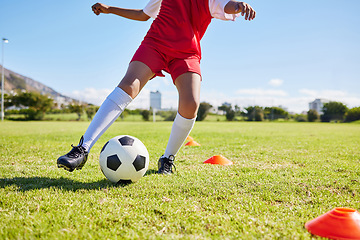 Image showing Soccer kid, field and training for sport fitness, balance and control with speed, body health and development. Cropped football player child, fast dribbling and exercise feet on pitch with commitment