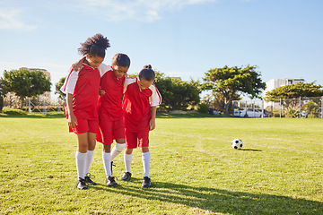 Image showing Children, soccer and girl team help, support and walking with injured friend at soccer field. Sports injury, kids and football player group helping, holding and carrying player for football accident