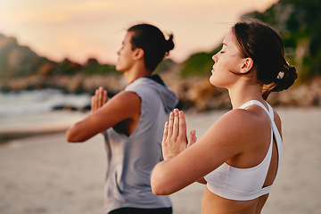 Image showing Yoga couple, prayer hands and meditation at beach.outdoors for health and wellness. Sunset, pilates fitness and man and woman with namaste hand pose for training, calm peace and mindfulness exercise.