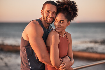 Image showing black couple, hug and relax beach fitness together for cardio workout, exercise training and freedom outdoor. Black man, woman smile and happy hugging by ocean sea for bonding or runner wellness rest