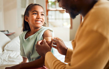 Image showing Injury, father and arm bandage for girl after accident in bedroom. First aid, black family and man apply bandaid or plaster on wound of hurt or injured child for wellness, recovery and healthcare.