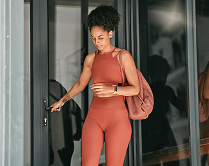 Image showing Ready, welcome and door with black woman in gym for workout, exercise and motivation. Training, wellness and sports with girl athlete and bag for cardio, endurance and stamina goal lifestyle