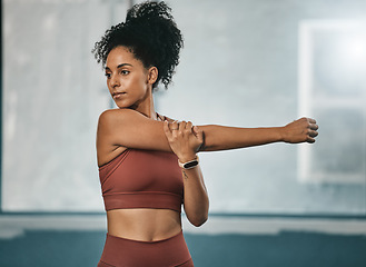 Image showing Black woman, stretching arms and fitness exercise for cardio training. wellness workout and mindset motivation. African athlete, runner warm up ready and body stretch routine in sports health gym