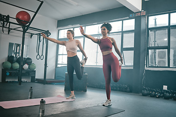 Image showing Balance, stretching and friends with women in gym for training, workout and exercise. Teamwork, health and personal trainer with girl and muscle warm up for wellness, sports and fitness goals