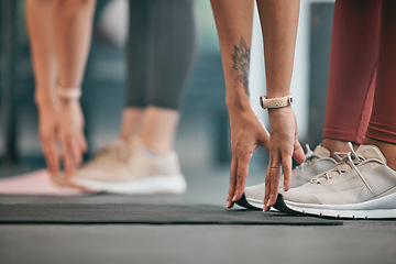 Image showing Fitness, hands or friends stretching legs at gym to warm up body or relax muscles for workout exercise. Women, focus or healthy sports people training together for support, inspiration or motivation