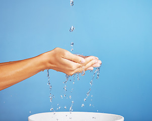 Image showing Clean water, pure and ecology with palm for sustainability, eco friendly and fresh on blue background. Environmental, treatment and person saving stream for health, wellness and cleaning on backdrop