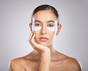 Image showing Beauty, eye patch and portrait of woman with skincare product for self care, anti aging and wellness. Facial healthcare, spa salon and aesthetic model face with makeup cosmetics on studio background