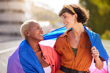 Image showing Friends, city and pride flag in street with support, smile and solidarity with human rights for lgbt people. Women, non-binary march, parade and diversity in urban metro for lgbtq, equality and peace