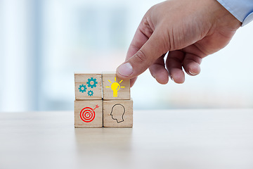 Image showing Business, hand and wooden block with icon for idea, strategy and target for building startup company. Growth, development and goals, blocks for planning process and future success at small business.