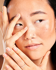 Image showing Asian woman, face and hands thinking for beauty wellness, skincare dermatology cosmetics skin glow in studio. Model, facial treatment and relax natural self care vision or cosmetology healthcare