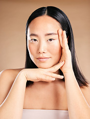 Image showing Asian woman, beauty portrait and hands for skincare wellness, dermatology cosmetics and natural skin glow in studio. Model, face treatment and relax self care vision or cosmetology facial healthcare