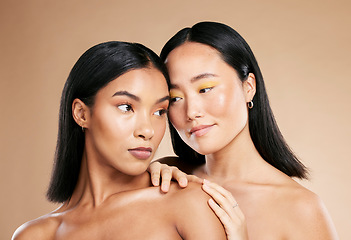 Image showing Love of friends or women for skincare, makeup and cosmetics with diversity and inclusion in studio. Asian and black person for skin glow, spa facial and color on face with dermatology product