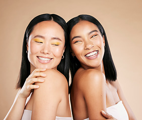 Image showing Happy women, diversity and makeup for beauty, skincare and dermatology cosmetics in studio. Asian and black person friends together for skin glow, spa facial and luxury face cosmetic product