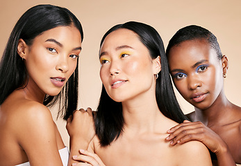 Image showing Diversity, skincare and women with cosmetics, dermatology and wellness on brown studio background. Makeup, multiracial and ladies with healthy, smooth and clear skin for confidence and wellness