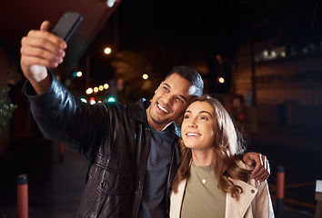 Image showing Couple of friends, phone or night selfie on city street or road for social media, profile picture or birthday celebration vlog. Smile, happy or influencer people bonding in dark while live streaming