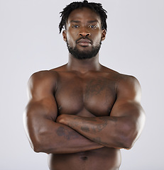 Image showing Muscle, fitness and sexy black man portrait in studio for strong body and power. Health and wellness of a confident male bodybuilder person with arms crossed after exercise, workout and training