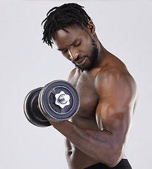 Image showing Fitness training, dumbbell exercise and black man in studio doing muscle workout. Body of a sexy and strong bodybuilder or sports person to train with weights for growth, health and wellness