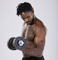 Image showing Dumbbell, exercise and fitness of a strong black man doing muscle workout in studio. Body of sexy bodybuilder person training with weight for power, health and wellness or growth as sports motivation