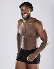 Image showing Black man, fitness and happy body portrait of sports person in studio for strong muscle and underwear. Health and wellness of sexy male bodybuilder laughing after exercise, workout and training