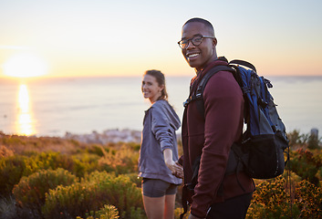 Image showing Portrait, wellness and hiking interracial couple exercise in sunset on a mountain as a morning workout in nature. Fitness, man and woman in a relationship training for health and wellness together