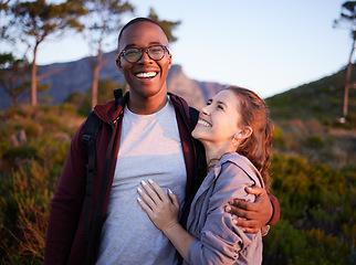 Image showing Smile, nature and portrait of interracial couple on mountain for holiday, vacation and hiking adventure on weekend. Travel, dating and happy man hugging woman enjoy calm, outdoor freedom and peace