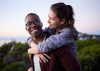 Image showing Love, nature and interracial couple piggyback on mountain adventure for holiday, vacation and hiking on weekend. Travel, dating and happy man carry woman enjoying calm, outdoor freedom and peace