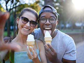 Image showing Love, ice cream or couple take a selfie in a park on a romantic date in nature in an interracial marriage. Pictures, black man or happy woman eating or enjoying a snack on holiday vacation