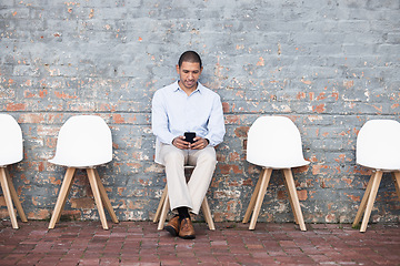 Image showing Phone, recruitment or startup man in digital agency waiting room on tech for HR or hiring team. Business man, research or employee on smartphone job interview for cyber, programmer or hacker meeting