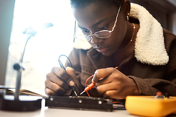 Image showing University student, engineering and electronics with black woman learning on electrical project. Education, engineer or technician with technology voltage test for electricity and innovation in class