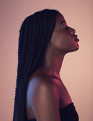 Image showing Peace, calm and black woman with braids in a studio with a makeup, cosmetic and face routine. Sensual, cosmetics and African female model with a relaxing positive mindset isolated by pink background.