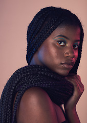 Image showing Portrait, hair and makeup with a model black woman in studio on a wall background for natural haircare. Face, beauty and braids with an attractive young female posing to promote keratin treatment