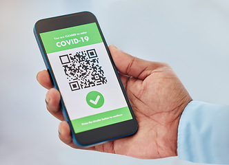 Image showing Covid, vaccination and mobile certificate for travel, trip or medical certification on a phone. Technology, healthcare and closeup of hand with app for coronavirus with barcode for immunity vaccine.